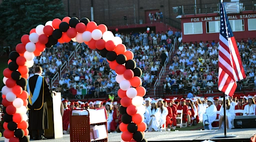 Dr. Glass addresses seniors and the crowd at graduation